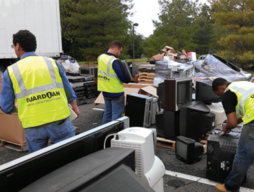 sorting old electronics for recycling